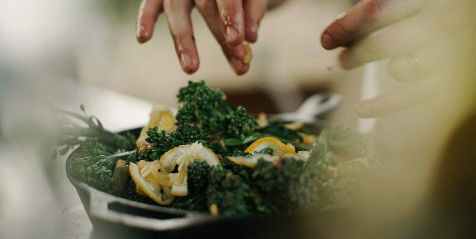 woman dressing a salad